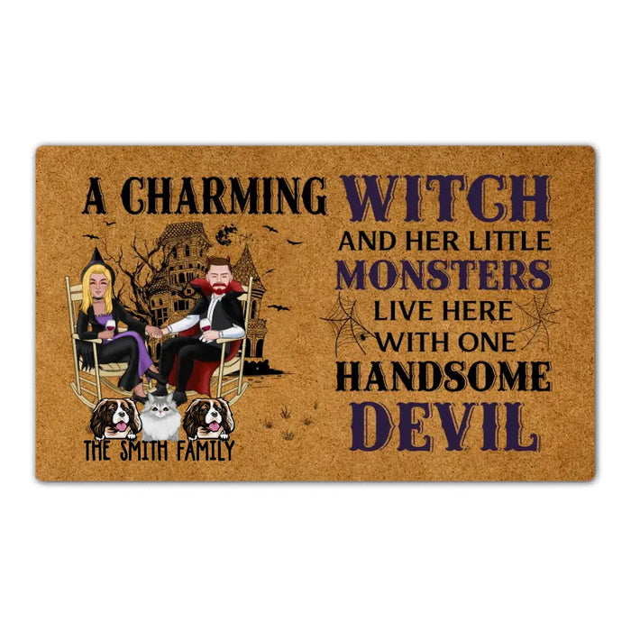 A Charming Witch and Her Little Monsters Live Here with One Handsome Devil - Personalized Gifts Custom Halloween Doormat for Fur Family, Dog Cat Lovers